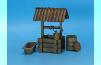 Wooden Water Well with wooden bucket, wooden barrel and cast ironbathtub.