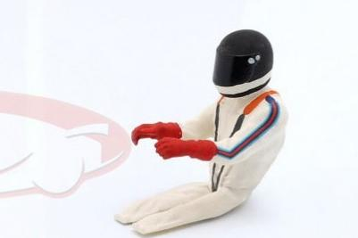 Фигурка сидящего гонщика в черном шлеме (1977)