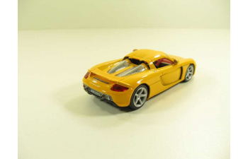 PORSCHE Carrera GT, 143PND 1:43, желтый